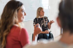 Worker speaking in meeting