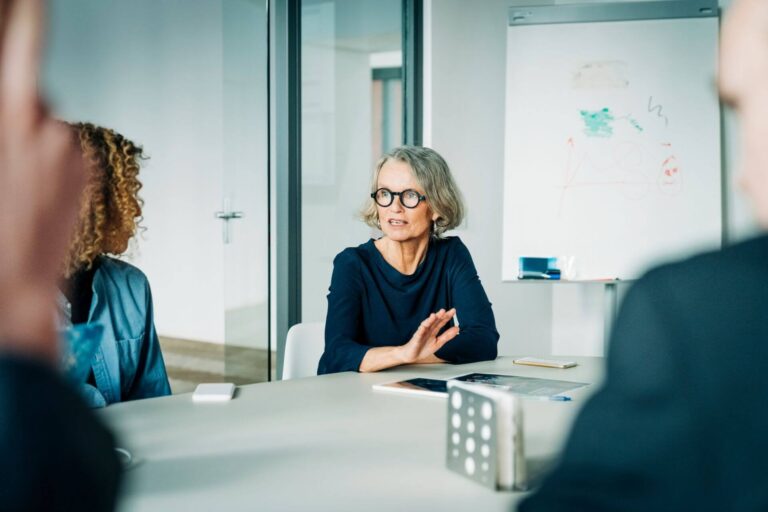 Female worker speaking in meeting