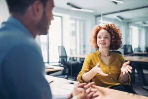 Workers smiling in meeting