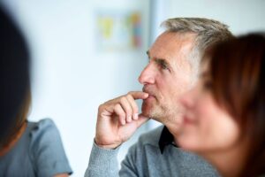 Worker speaking in meeting