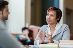 Worker speaking in meeting