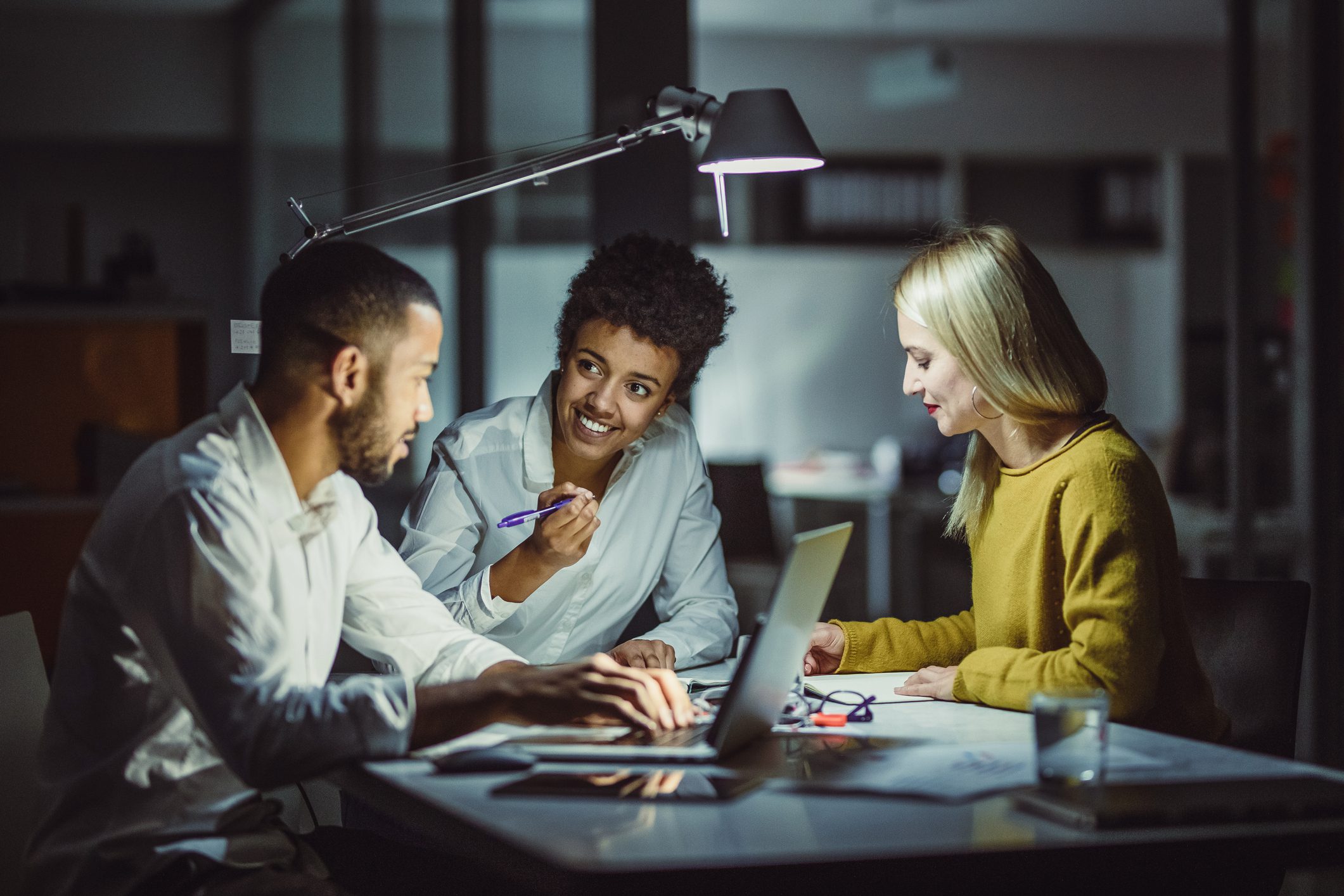 Three workers collaborating